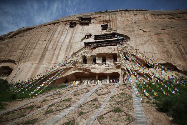 Restoration of ancient grottoes begins in China's Gansu