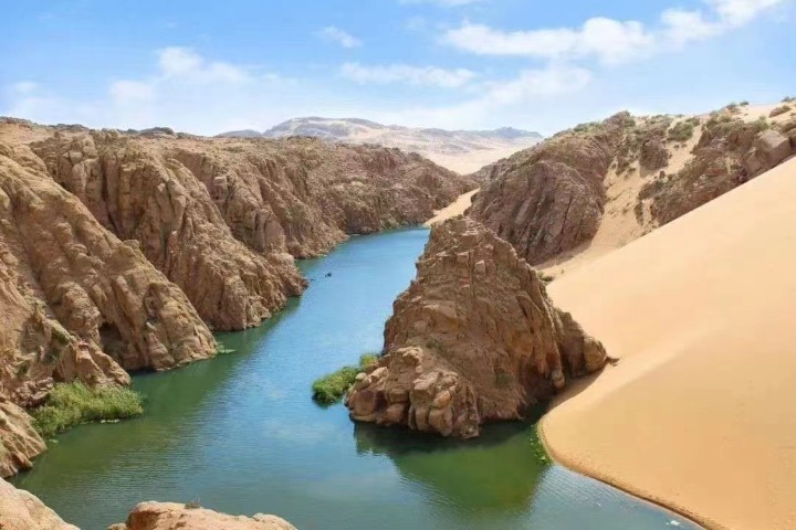 Lake surrounded by desert is rare sight