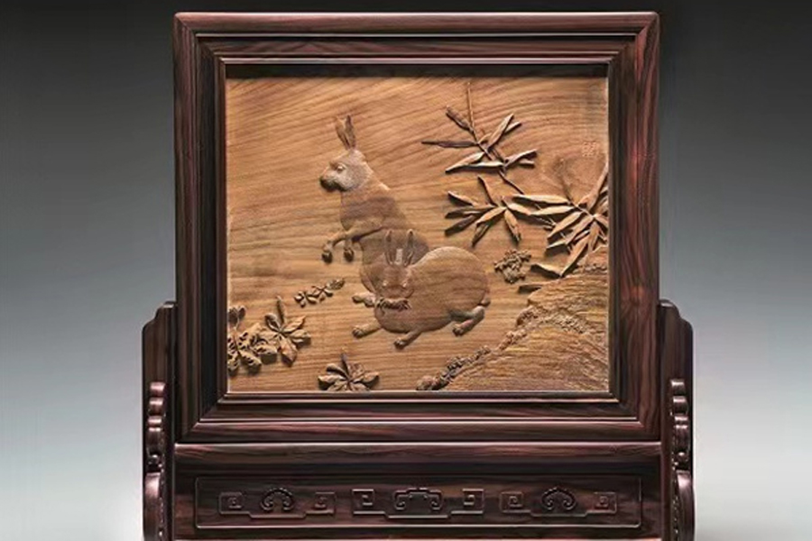 Wooden table screen with paired rabbit relief