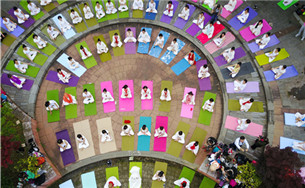 Locals practice yoga for health in Guiyang