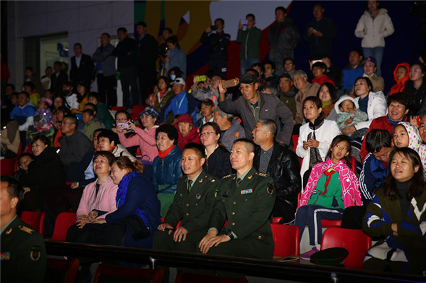 Visitors watch the opening ceremony of the Fifth International Equestrian Festival in Hohhot, Inner Mongolia autonomous region on Sept 21.jpg