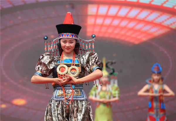 Performers showcase the traditional ethnic Mongolian customs during the opening ceremony of Yuquan Folk Festival in Hohhot.jpg