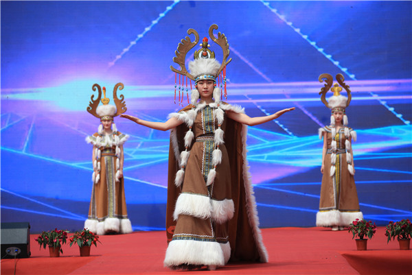 Performers showcase the traditional ethnic Mongolian customs during the opening ceremony of Yuquan Folk Festival.jpg