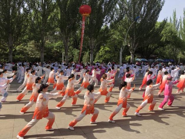 Senior lovers perform Tai Chi in unified outfits in Hohhot, North China's Inner Mongolia autonomous region on May 19.jpg