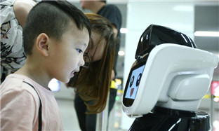 People interact with intelligent robot 'Xiaogui'