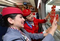 Foreign volunteers serve passengers during Spring Festival travel rush in China's Xi'an