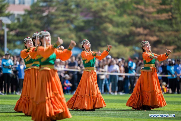 Students of Hohhot Minzu College perform dancing at a Nadam fair of the school in Hohhot.jpg