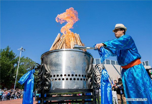 A ritual is held during a Nadam fair of Hohhot Minzu College in Hohhot.jpg
