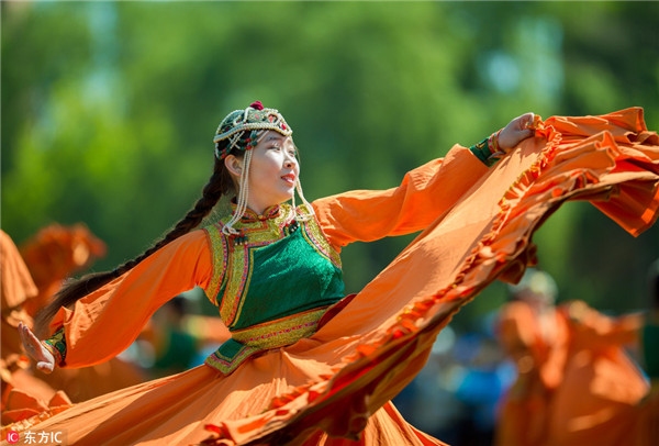 Students of Hohhot Minzu College perform dancing at a Nadam fair of the school in Hohhot，Inner Mongolia.jpg