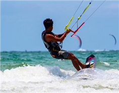 World kiteboarders confront wind and wave in Beihai