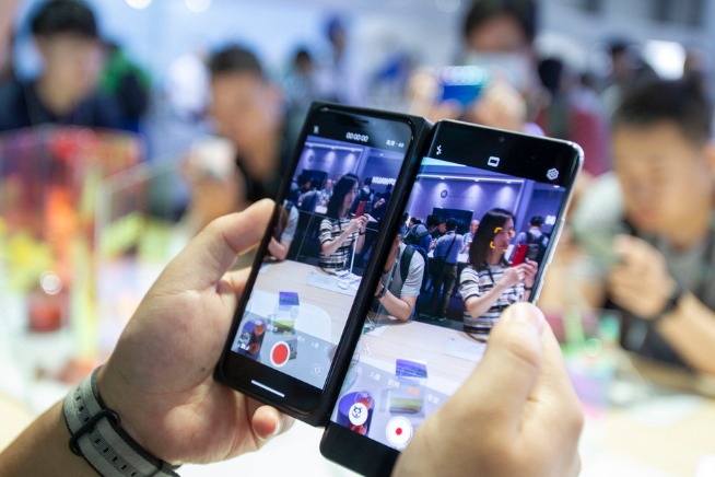 China ships more phones in market upswing