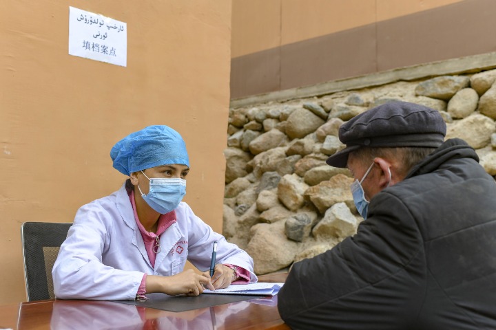 In remote Xinjiang, medics on the go to leave no one behind in 'Healthy China'