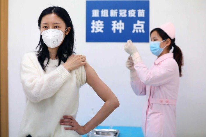 Wuhan vaccine volunteers happy to join battle against virus pandemic