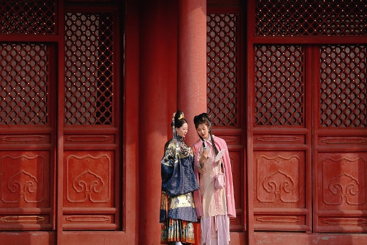 Traditional clothing and ancient palace add brilliance to each other