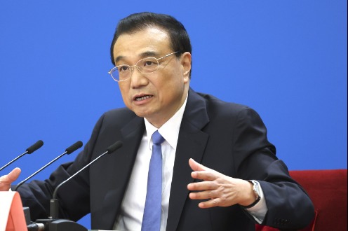 Country will open wider to world, Li says