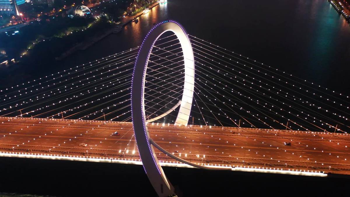 Bridge with ring-like tower adds to urban night views