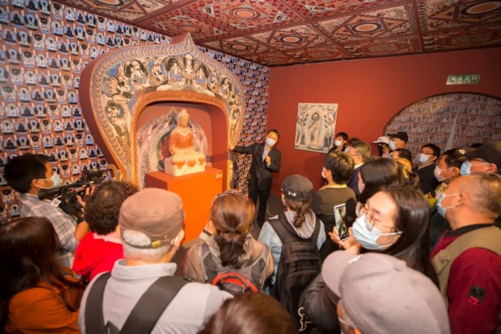 Exhibition highlights beauty of architecture and gardens in Dunhuang grotto murals