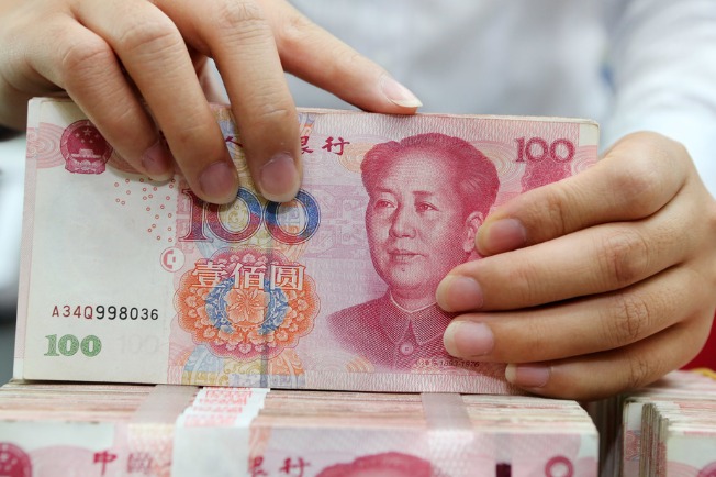 Central bank to expand cross-border investment, strengthen yuan