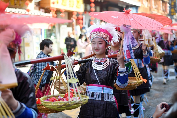 Dong people dress up to celebrate Dongnian Festival
