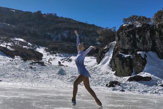 Figure skating enthusiast shows her stuff on frozen lake