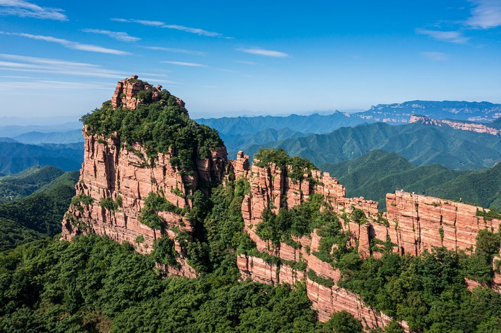 Zhangshiyan Scenic Area known for its magnificent landforms with red rocks