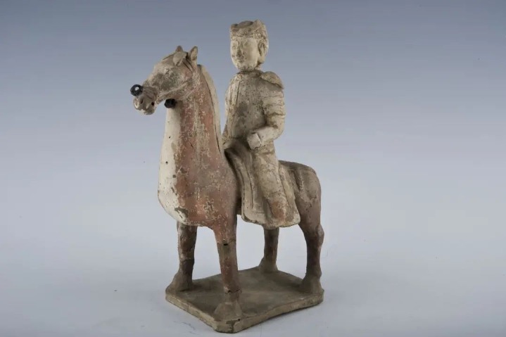 Painted pottery figurine depicts a warrior riding a horse