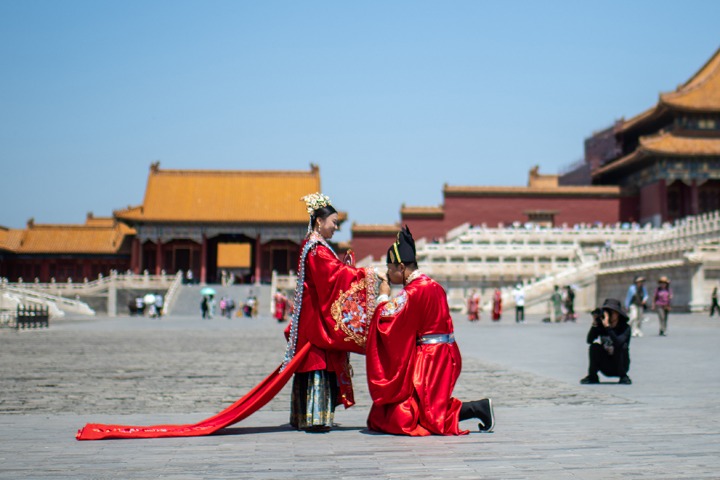 Couples take wedding photos in the Forbidden City