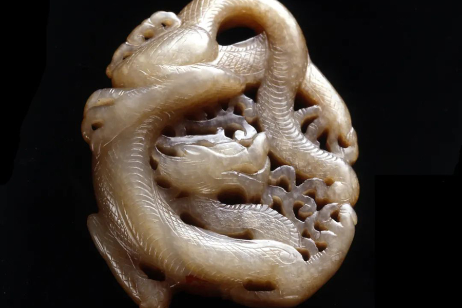 White jade pendant in the shape of a dragon