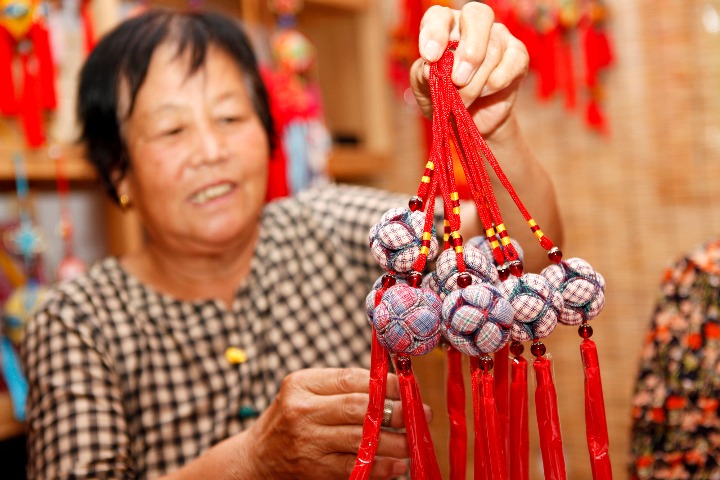 Women profit as they keep silk ball tradition alive