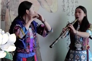Dong women play famous Chinese folk song on flutes in Guizhou’s Yuping