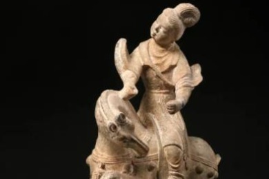 Maid on horseback figurine from Tang Dynasty