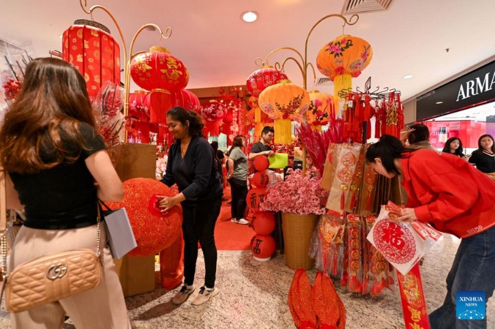 People buy decorations for Spring Festival in Malaysia