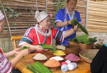 Miao community crafts rainbow zongzi for Dragon Boat Festival