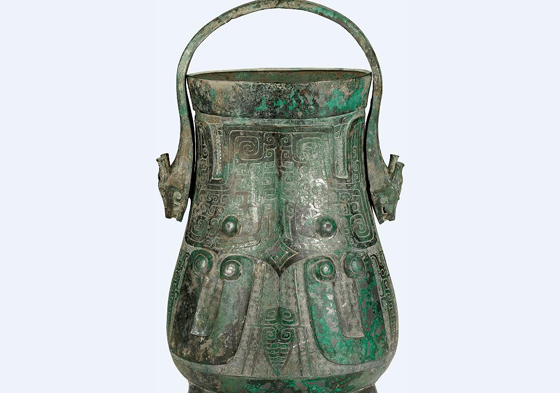 Shang Dynasty bronze wine container with beast mask motifs