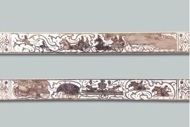 Han Dynasty wooden ruler depicts chariots and horses on the move
