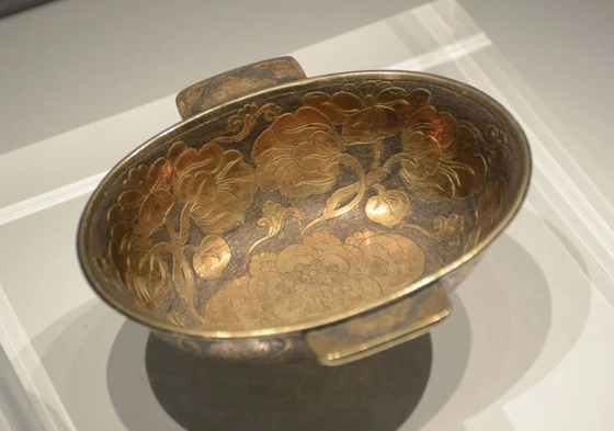 Tang Dynasty gilt silver ear cup 'holds' spring blossoms